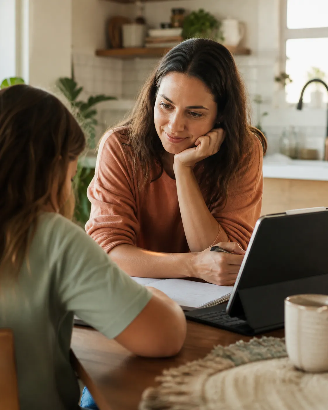 Parent and child looking at learning progress together